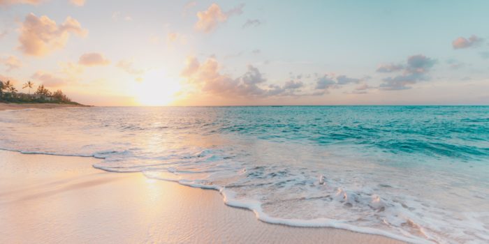 Waves on a beach at sunset
