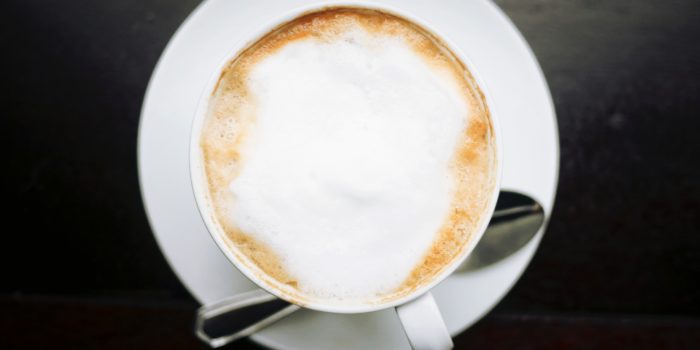 A bird's eye view of a cup of coffee.